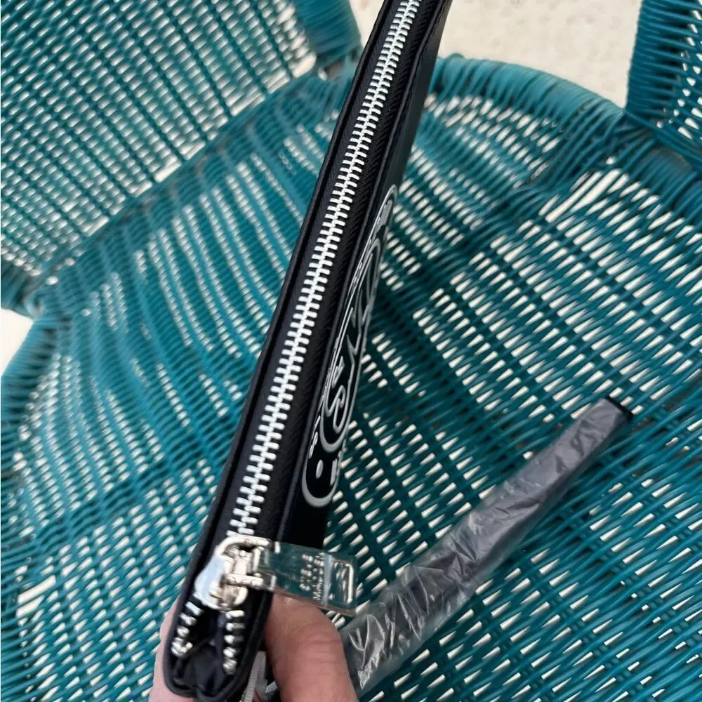 Steve Madden Black Round Logo Zip Clutch